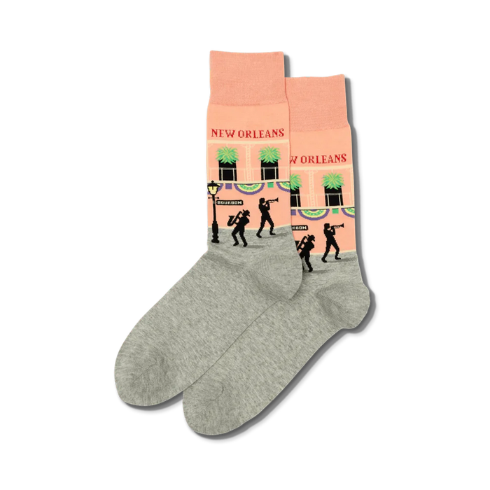 men's new orleans crew socks. pink, gray. pattern: bourbon street with musicians, lamp, building. music theme.  
