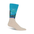 Crew socks showcasing a Chicago skyline in teal and beige. The design includes the city's famous Bean sculpture and two figures walking along the waterfront.