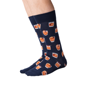 A pair of blue socks with a pattern of old fashioned cocktails.