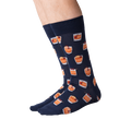 Back view of navy blue Old Fashioned cocktail socks on a person's legs.