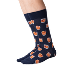 Back view of navy blue Old Fashioned cocktail socks on a person's legs.