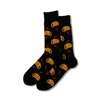 black crew socks with an all-over pattern of tacos and red chili peppers. perfect for taco tuesday. novelty men's sock. 