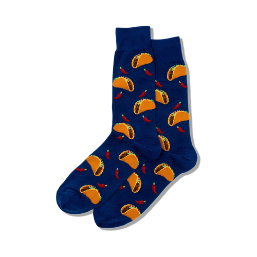 Lifestyle product shot showing a pair of blue crew socks with a taco and chili pepper print.