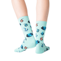 Back view of a person wearing teal Tropical Fish crew socks.