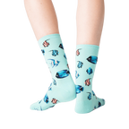 Back view of a person wearing teal Tropical Fish crew socks.