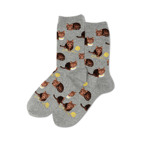 crew length gray womens socks with brown tabby cat pattern in various poses playing with yarn   