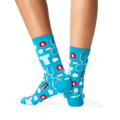 Back view of the teal medical socks on a person's legs. The socks are shown from the back, highlighting the pattern's wrap-around design.