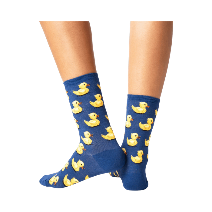 Close-up detail shot showcasing the yellow rubber duck design on the blue socks.