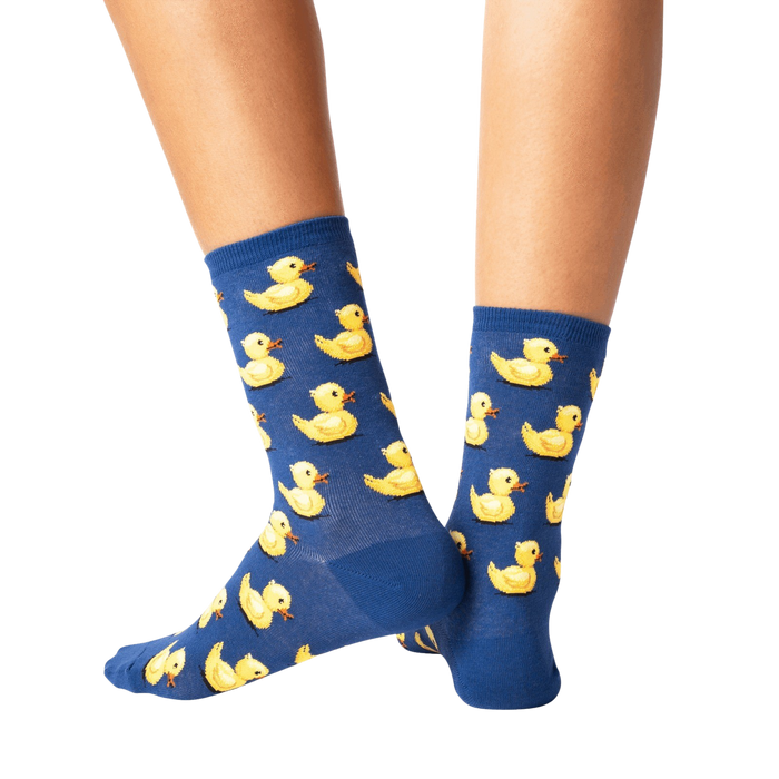 A pair of blue socks with a pattern of yellow rubber ducks.