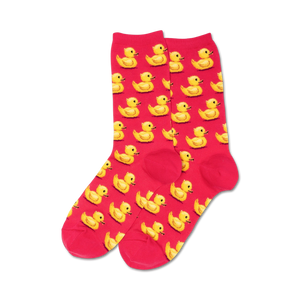 bright pink women's crew socks featuring a cheerful pattern of yellow rubber ducks arranged in neat rows. made of a soft and stretchy material.  