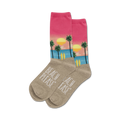 Pair of crew socks with a beach sunset design.  Pink and beige with palm trees, surfboards, and the words 'Beach Please'.