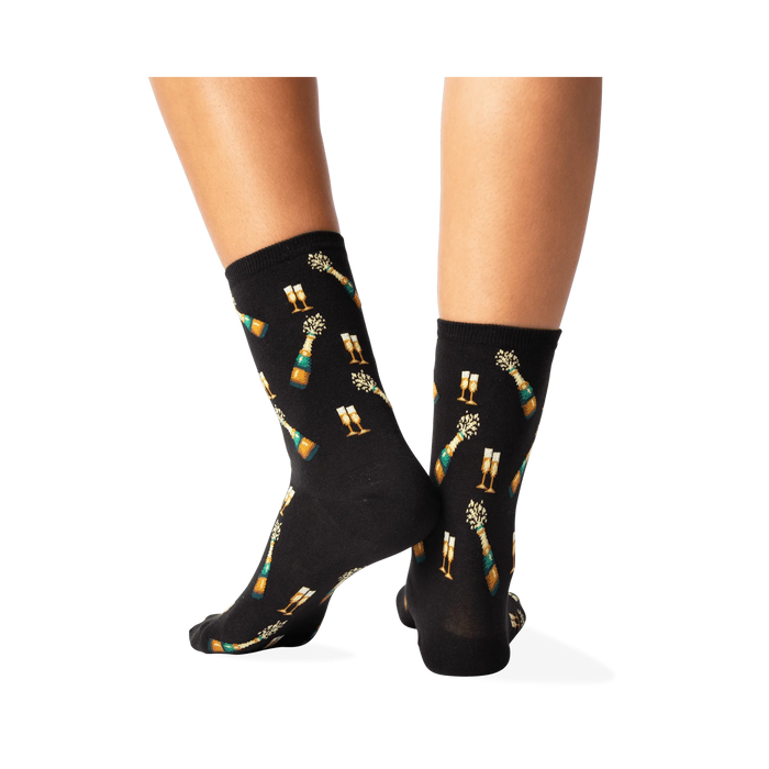 Back view of 'Champagne Bottles' socks on a person's legs, showcasing the full design repeat.