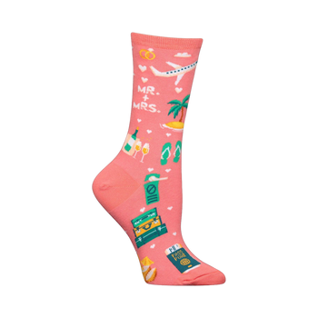 Coral pink crew socks with a honeymoon theme.  Design includes a plane, tropical island, flip-flops, champagne, wedding rings, passport, and suitcase.