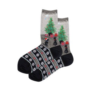 Crew socks in grey and blue. Design features black dogs, Christmas trees with gifts, and a snowflake Fairisle cuff.