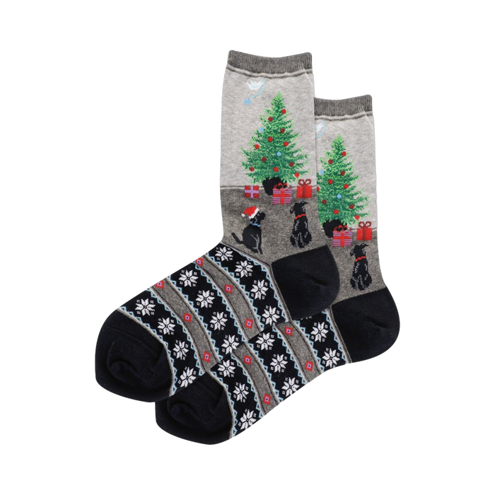Crew socks in grey and blue. Design features black dogs, Christmas trees with gifts, and a snowflake Fairisle cuff.