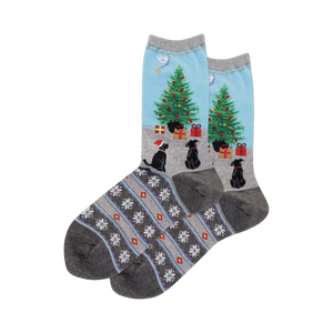Lifestyle shot of the Dog Christmas Tree Fairisle socks on a person's feet.