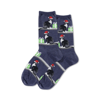 dark blue crew socks with a pattern of black cats wearing red santa hats on green presents for women  