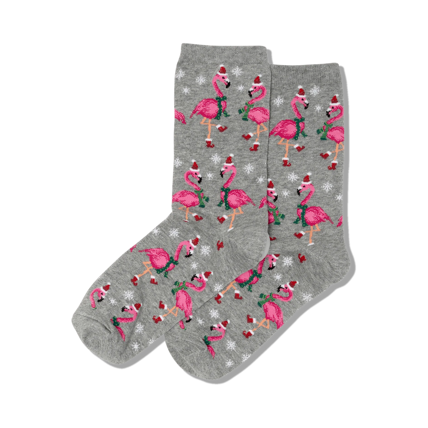 Pair of crew socks; grey background with pink flamingos wearing Santa hats and scarves, snowflakes.
