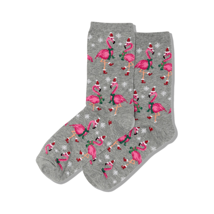 gray crew socks with santa claus hat and scarf-wearing pink flamingos and snowflakes.  