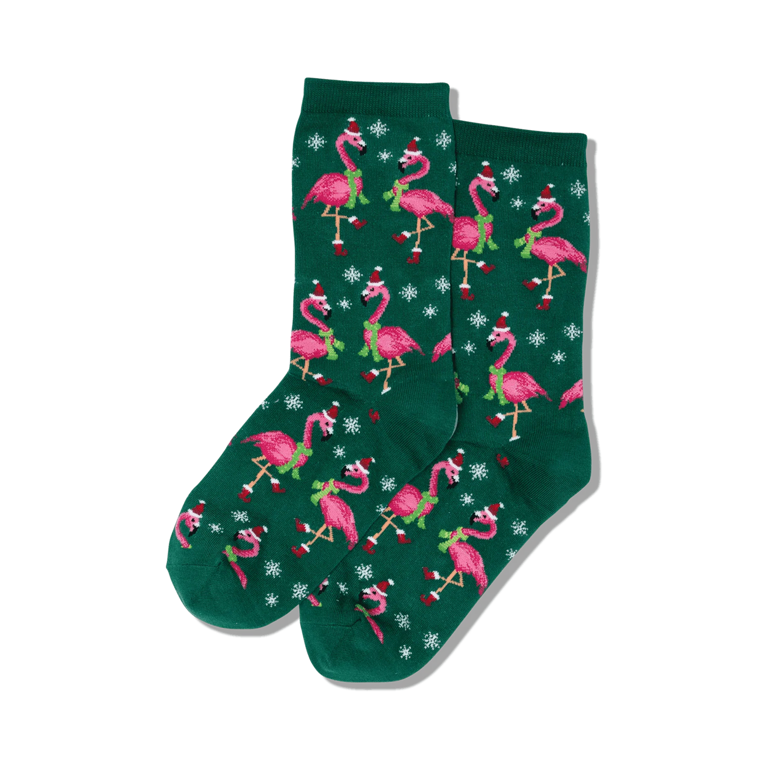 Pair of crew socks on a white background; dark green background with pink flamingos wearing Santa hats and scarves, snowflakes.