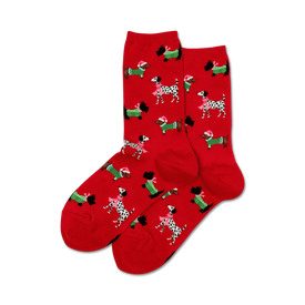 red crew socks featuring a pattern of cartoon dogs wearing santa hats and scarves.  