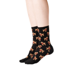 Lifestyle shot: A person's legs wearing the black poodle socks, showing the socks from the side.