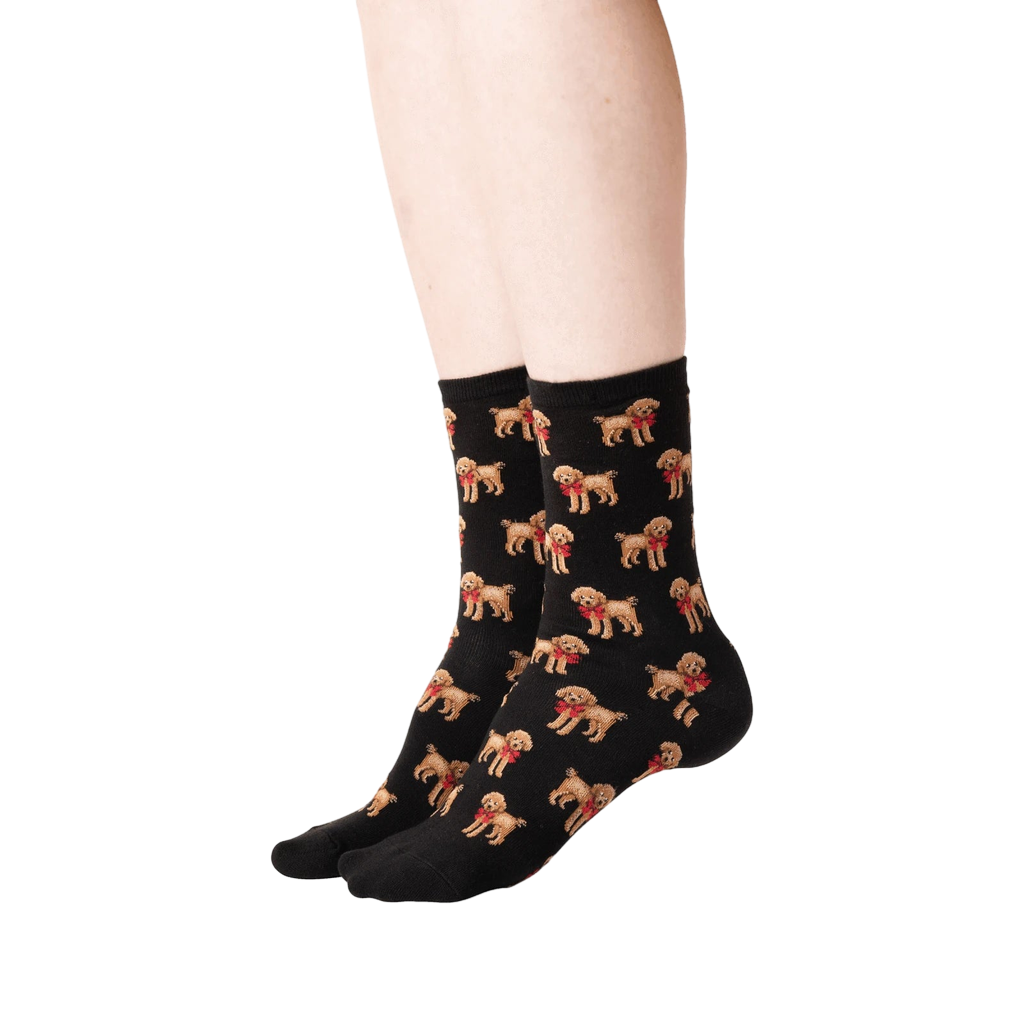 Lifestyle shot: A person's legs wearing the black poodle socks, showing the socks from the side.