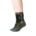 Lifestyle shot showing a person's legs wearing the Christmas Cactus Non-Skid Slipper socks.