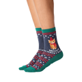 Close-up of model wearing a pair of Meowy Christmas socks.