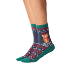 Close-up of model wearing a pair of Meowy Christmas socks.