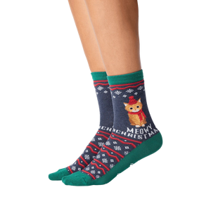 Close-up of model wearing a pair of Meowy Christmas socks.