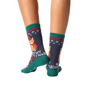 Rear view of model wearing a pair of Meowy Christmas socks.
