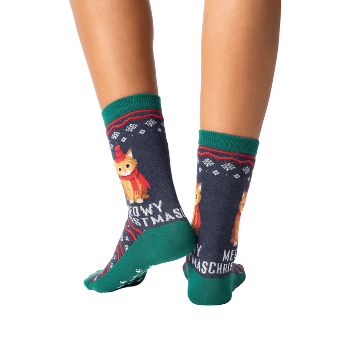 Rear view of model wearing a pair of Meowy Christmas socks.