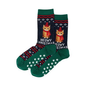Pair of dark-blue and green crew socks. Christmas-themed fair isle pattern with orange cats wearing hats, and 'Meowy Christmas' text. Non-skid paw print soles.