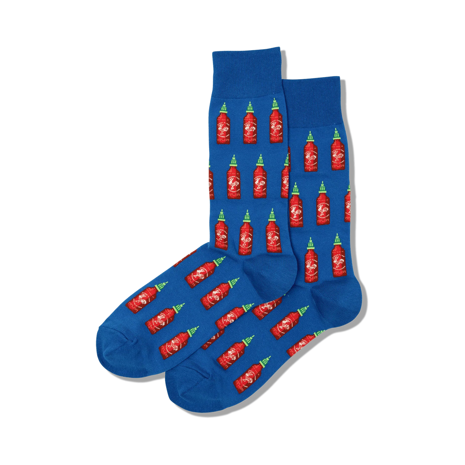 Pair of blue crew socks with a repeating pattern of red Sriracha bottles. Green bottle caps and white labels add a pop of color.