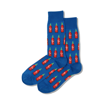 blue crew socks with a pattern of red, yellow, and green hot sauce bottles. hot sauce theme. men's size.   