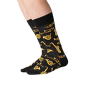 Lifestyle shot of a person's legs wearing black Jazz Instrument socks.