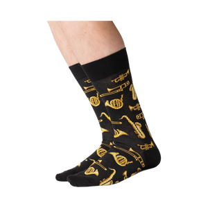 Lifestyle shot of a person's legs wearing black Jazz Instrument socks.