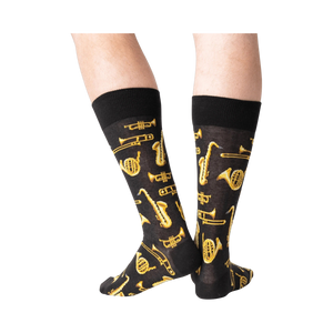 Back view of a person wearing black Jazz Instrument socks.