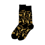 Pair of crew socks with a black background and a gold brass instrument print.  Saxophones, trumpets, trombones, and French horns are featured.