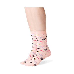 Close-up of a person wearing a pair of light pink sushi socks.