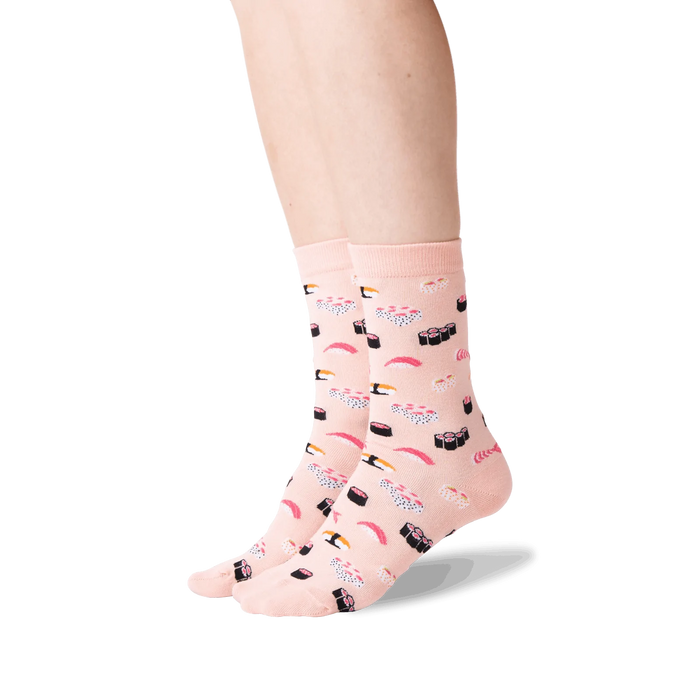 A pair of pink socks with a pattern of sushi.