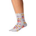 Lifestyle shot of a person wearing a pair of grey Peanut Butter and Jelly crew socks. The socks feature a fun pattern of PB&J sandwiches and jars.