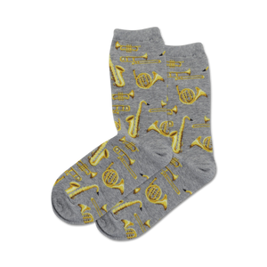 women's gray crew socks with a pattern of yellow musical instruments including trumpets, saxophones, clarinets, and trombones.  