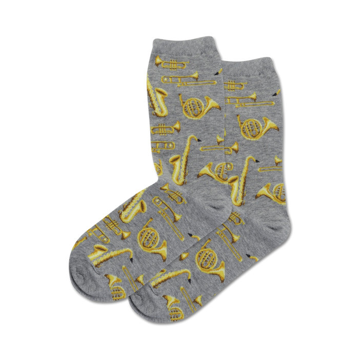 women's gray crew socks with a pattern of yellow musical instruments including trumpets, saxophones, clarinets, and trombones.  