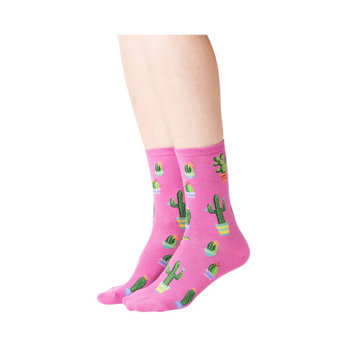 Lifestyle shot showing a model wearing the pink Potted Cactus socks.