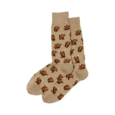 A pair of tan crew socks with a repeating pattern of brown pixelated roasted turkeys. Fun and festive!