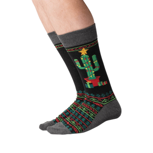 Lifestyle shot of a person wearing the Christmas Cactus Non-Skid Slipper socks.
