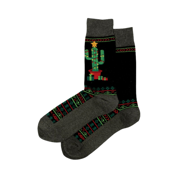 Pair of Christmas Cactus Non-Skid Slipper socks. Black with a decorated cactus image, geometric patterns, and grey cuffs.