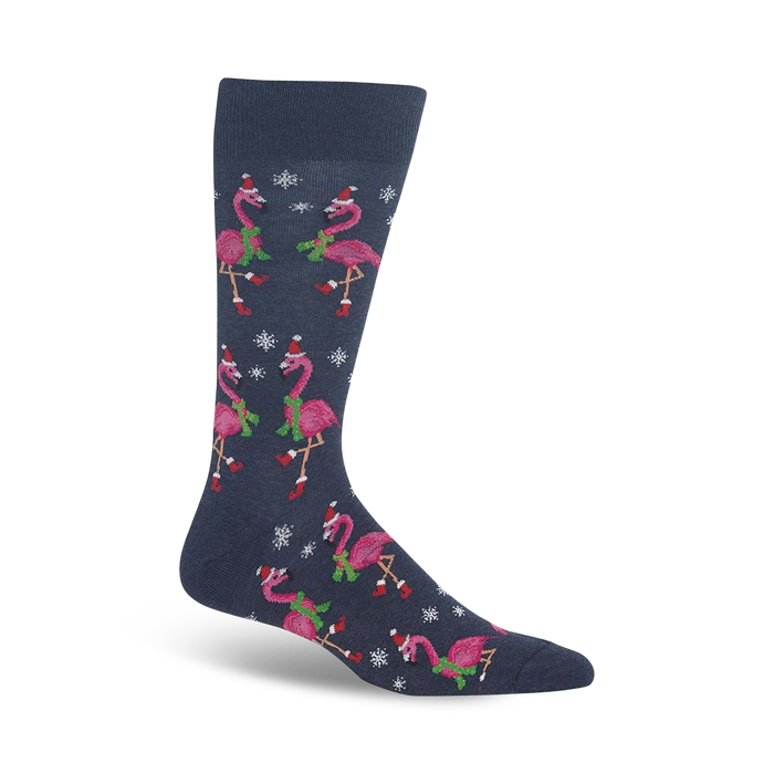 dark blue crew socks with a pattern of pink flamingos wearing santa hats, green scarves, and snowflakes - perfect for christmas.   }}